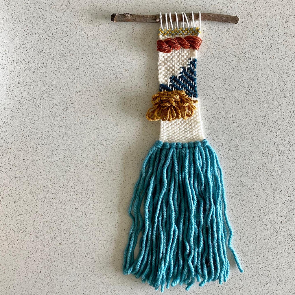 Lauren Blue, white, and ochre weaving.
