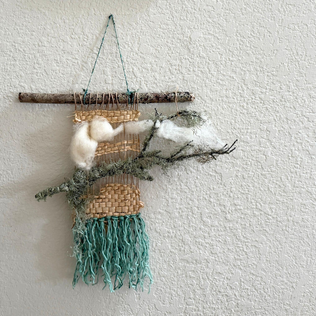 Karl Natural fiber weaving that incorporates a foggy branch.